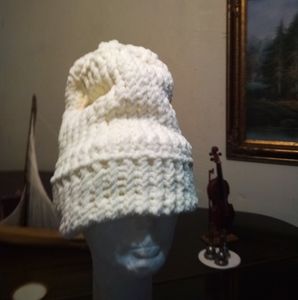 Hand knitted cap.